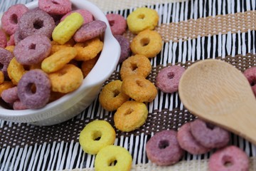 Bowl with colorful round cereals