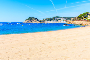 Fototapeta na wymiar Sandy beach and bay in Tossa de Mar town, Costa Brava, Spain