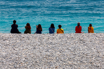 Tourists vacationing on the city promenade on a sunny day. Nice. France.