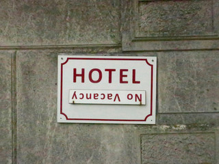 vacancy sign on the wall of an old hotel