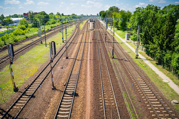 Six railroad tracks. Underloaded tracks and railway station. Skyline. Wide view from above.