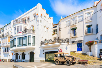 CADAQUES VILLAGE, SPAIN - JUN 4, 2019: Old Jeep parking on coastal promenade in Cadaques village, Costa Brava, Spain.
