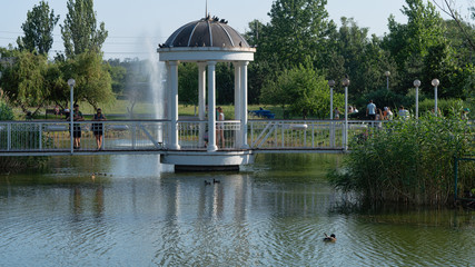 beautiful gazebo by the lake in the park