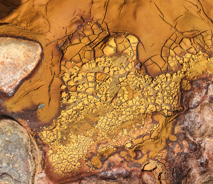 From above beautiful orange streams and transitions on rock in Mines of Riotinto Huelva