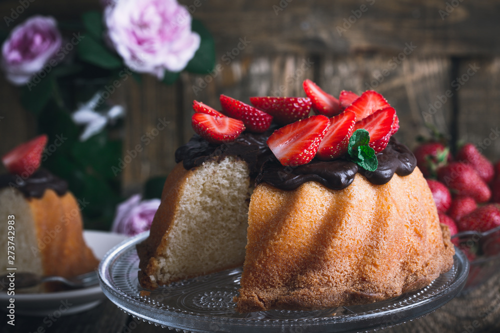 Wall mural Summer cake with chocolate glaze and fresh strawberries