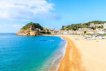 Blue azure sea and sandy beach view in Tossa de Mar, Costa Brava, Spain