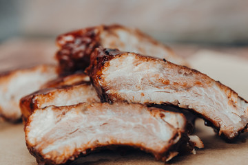 Closeup of pork ribs grilled with BBQ sauce and caramelized in honey. 