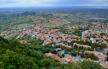 View from the top of San Marino castle towards the sea and over the San Marino villages and Rimini, Italy