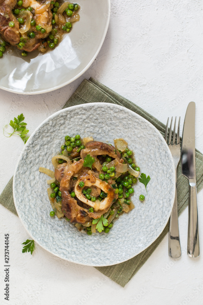 Canvas Prints Ossobuco alla milanese - Lombard cuisine of cross-cut veal shanks, made with white wine, broth and green peas.