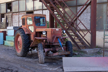 Obraz premium Tractor on the farm, a oid agricultural transport. Agricultural machinery.