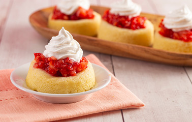 A Single Serve Strawberry Shortcakes with Strawberry Sauce and Whipped Cream