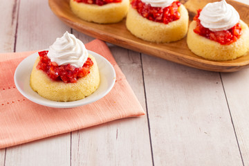 A Single Serve Strawberry Shortcakes with Strawberry Sauce and Whipped Cream