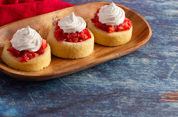 A Single Serve Strawberry Shortcakes with Strawberry Sauce and Whipped Cream