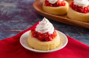 A Single Serve Strawberry Shortcakes with Strawberry Sauce and Whipped Cream