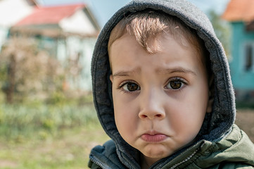 child with a sad face portrait
