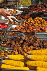 Different types of fried meat on the table. BBQ at the festival.