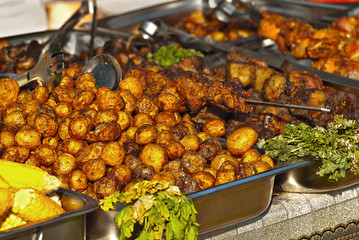Different types of fried meat on the table. BBQ at the festival.