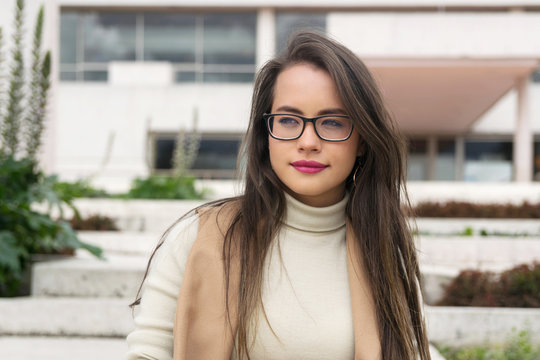 Pretty woman in glasses looking away