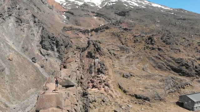 Aerial view of the Mead's Wall, New Zealand, while a tourist is climbing the wall.