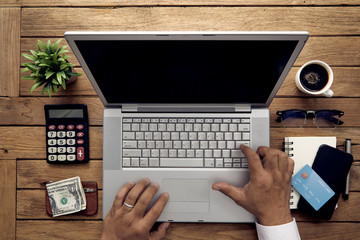 man hand using laptop computer