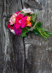 boquet of roses on old wooden surface