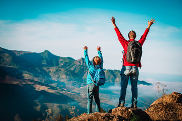 father and son travel in nature, family hiking in mountains © nadezhda1906