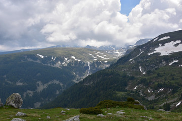 Springtime in Rila Mountains, Bulgaria - view from the slopes of Kabul Peak to Skakavitsa waterfall at distance