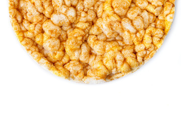 Caramelized corn cakes. Puffed whole grain crispbread isolated on white background. Close-up.
