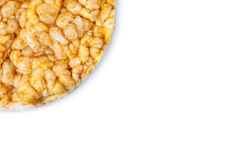 Caramelized corn cakes. Puffed whole grain crispbread isolated on white background. Close-up.
