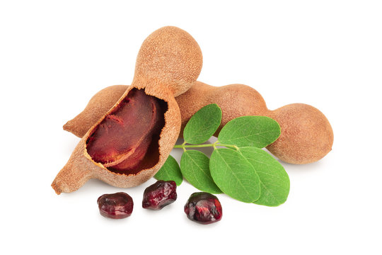 Tamarind fruit and seeds isolated on white background