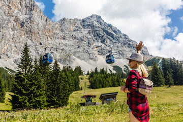 Young Woman blonde enjoying mountains landscape Travel Lifestyle happy emotions concept adventure outdoor active vacations in Norway girl tourist walking