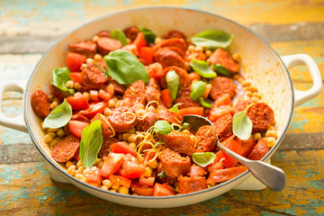 Fried chorizo sausage with chickpeas, tomatoes, lemon & basil 