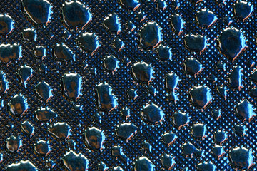 Silver Reflective Fabric Material Texture with Imitation of Water Droplets . Abstract Background of a Reflector Fabric for Lighting Equipment.