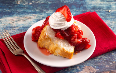 Slice of Strawberry Short Cake Made with Angel Food Cake and Strawberry Sauce