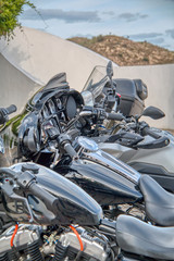 Several customized shiny black motorcycles