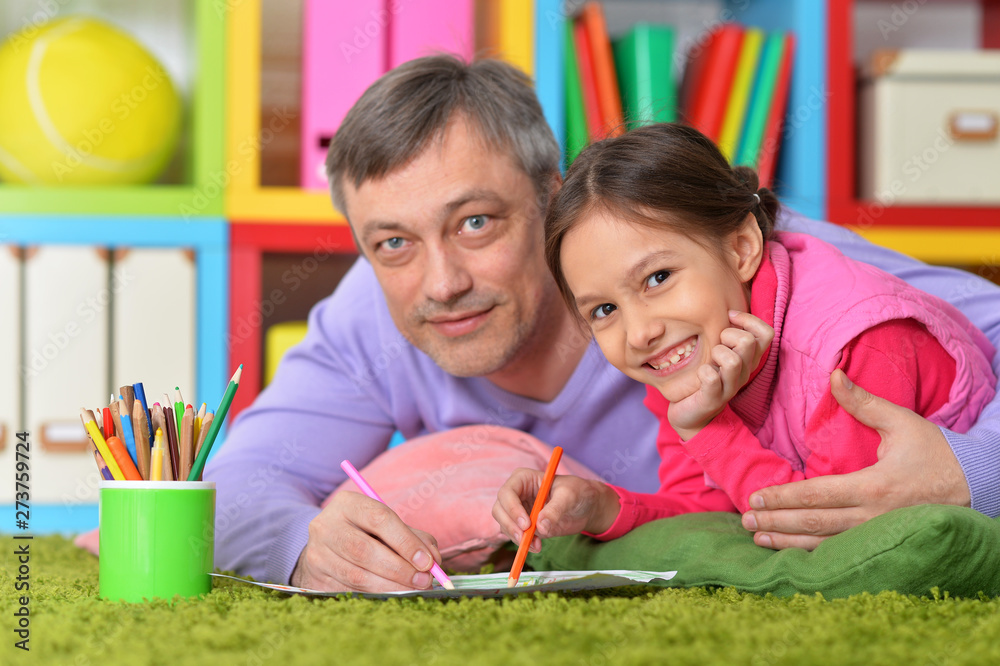 Wall mural portrait of happy father and his cute daughter