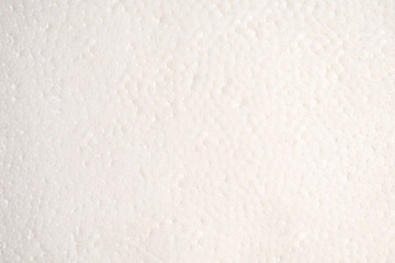 Textured background of white polystyrene foam