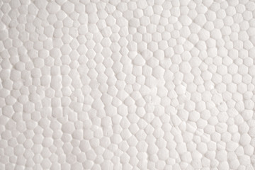 Fototapeta na wymiar Textured background of white polystyrene foam