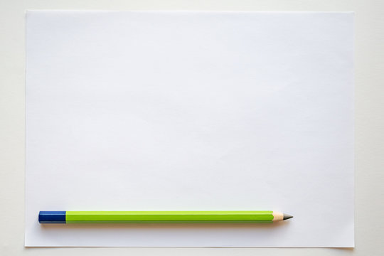 White blank sheet with pencil on white background