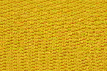 Yellow mesh texture of sports backpack macro shot