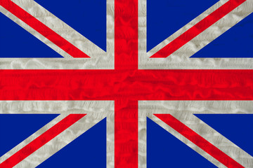 Fototapeta premium beautiful national flag of the country of Great Britain on a soft background texture of knitted wool with small fills of linen