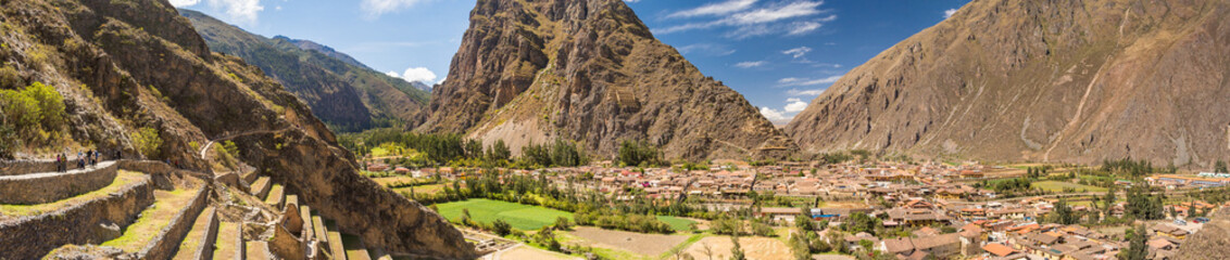 View from Pumatallis terraces, in the Ollantaytambo archaeological site, of the inca town. Amazing panorama of the ancient city, the ruins and the valley. Travel destination in the Sacred Valley, Peru