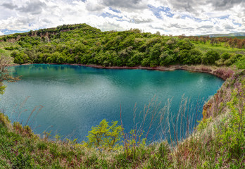 Fototapeta na wymiar Mountain lake in a green valley.