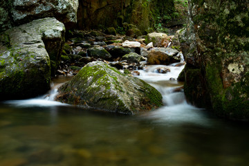 Waterfall over the rocks.