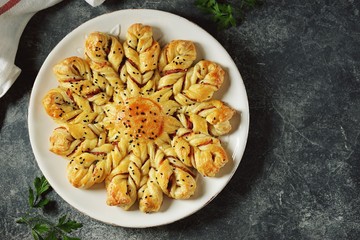Puff pastry pie with ham and cheese. Homemade delicious pastries. Top view. 