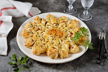 Puff pastry pie with ham and cheese. Homemade delicious pastries. Top view. 