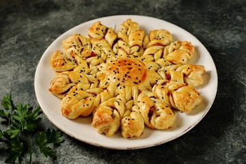 Puff pastry pie with ham and cheese. Homemade delicious pastries. Top view. 