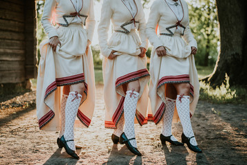 Latvian folk dancers in Abrenes folk dress - obrazy, fototapety, plakaty