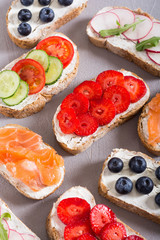 Variation of toast with fruit , vegetable and salmon