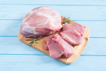Raw pork meat on wooden background